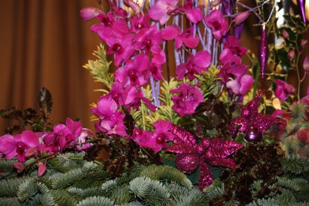 Pink & purple mantel piece arrangement with candles by Richard Haslam.