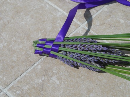 You weave the ribbon through the stems as you fold the stems over.