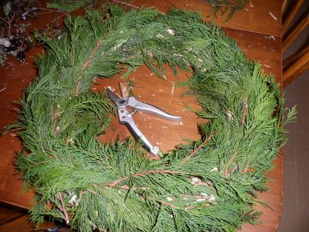 Filling in the greens to cover the straw.