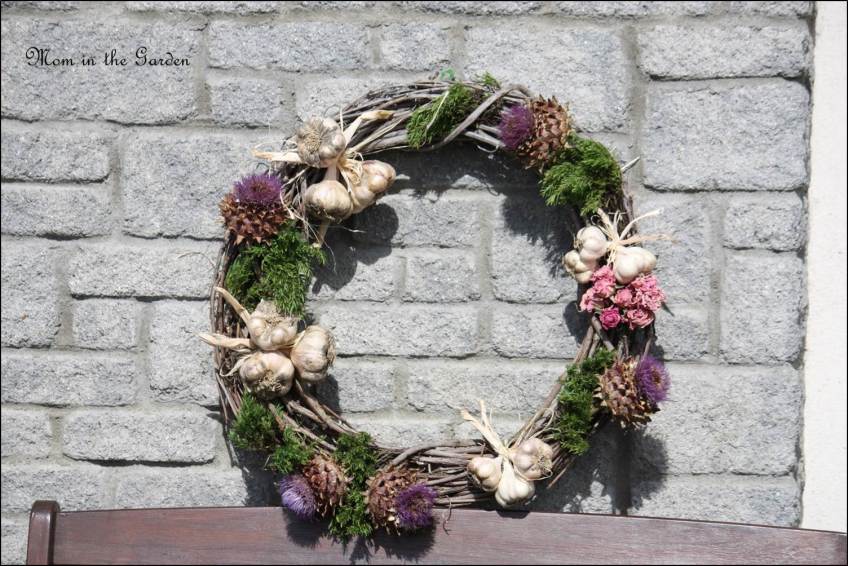wreath made with garlic, dried artichokes and dried roses