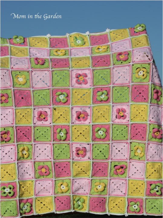 There is a yellow cross through the centre, and two diamonds of flowers. Can you see it?