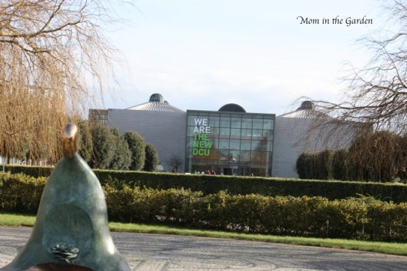 There is so much more to this picture than just a building. Do you see the hedges, trees, monument, paving???