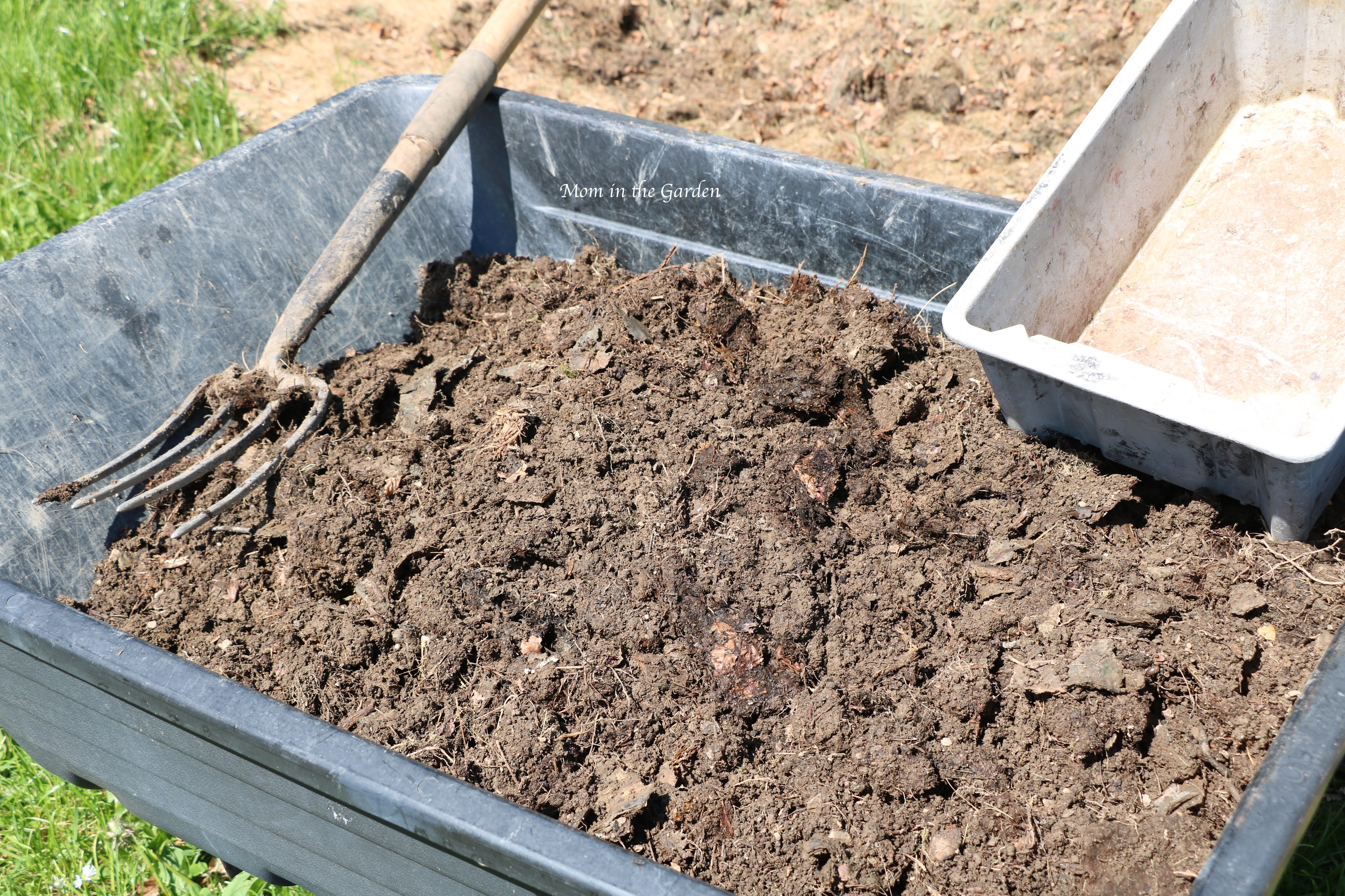 compost in a wheelbarrow