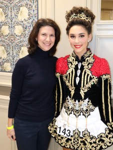 mom in the garden with her daughter in Irish dancing dress
