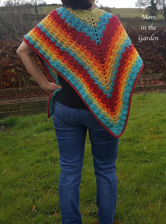 back view of completed rainbow poncho