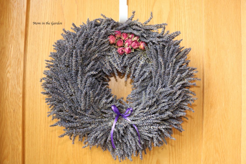 lavender wreath + roses on top + ribbon on door