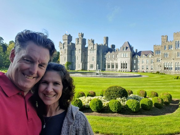 my husband and me in front of Ashford Castle