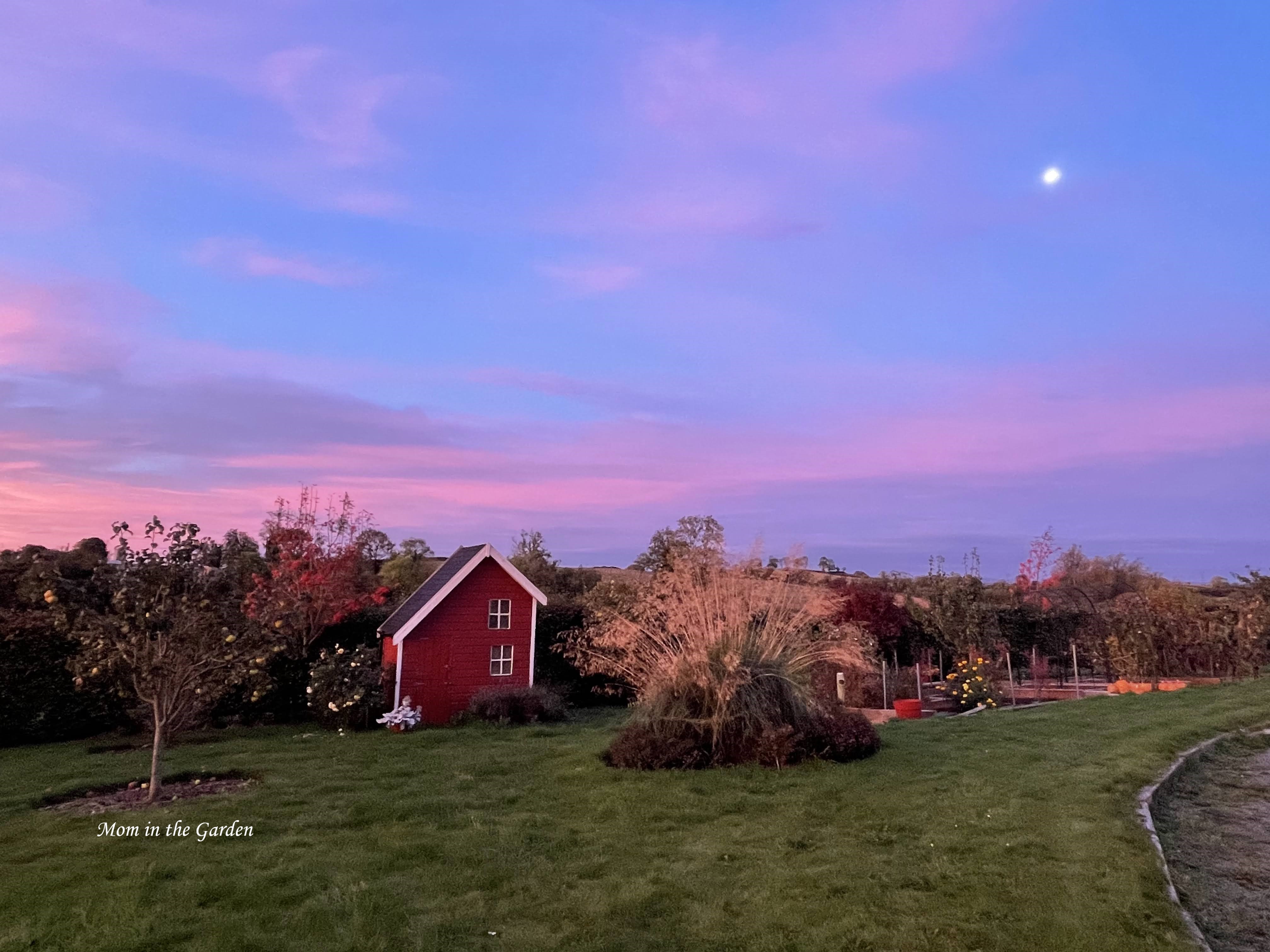 Sunrise with moon in sky