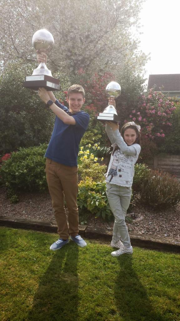 Cormac with his World Champion first place globe for u16 ceili dancing and Cliona with her 3rd place globe for u13 ceili dancing